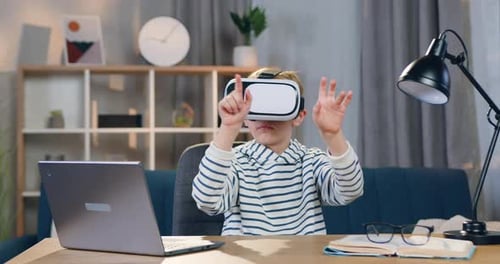 Boy Using Virtual Reality Headset at Home