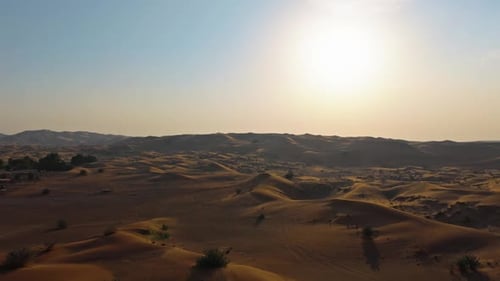 Drone View of Sunset Over Sand Dunes in Dubai Desert