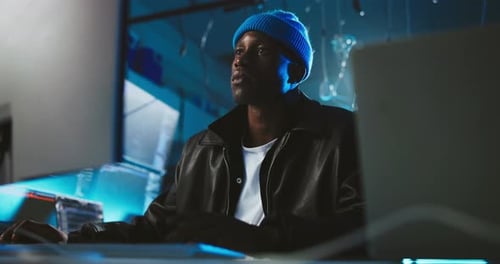 Night, computer and black man with coding, cyber security or thinking with software update