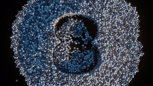 Numbers From One to Ten Emerge From a Collection of Blue and Grey Spheres Against a Black Background