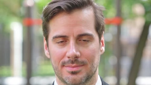 Close up of Serious Face of Young Businessman