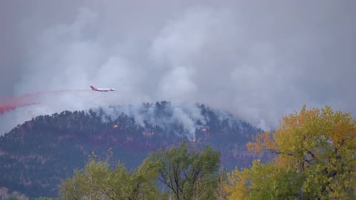 Water bomber plane releasing its load over the Calwood fire in Northern Colorado - 10.17.2020