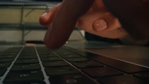 Woman Typing on Laptop Keyboard Close Up
