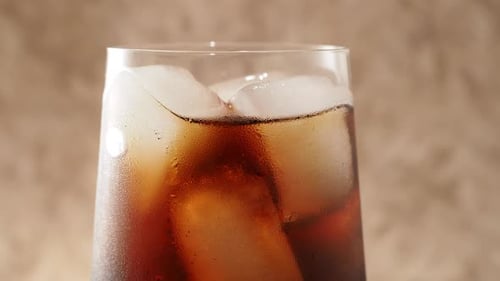 Rotating Cola with Ice in a Glass