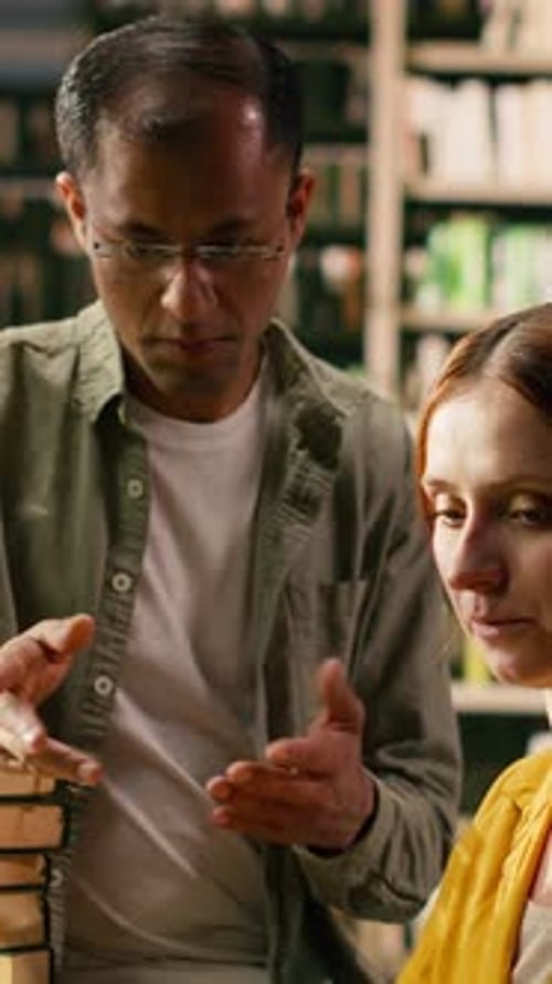 Vertical Video Tutor Guiding Young Woman Working on Laptop at University Library Desk