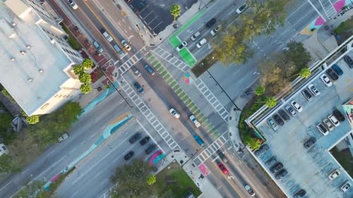 Top View of Wide Street with Moving Cars at Intersection with Traffic Lights