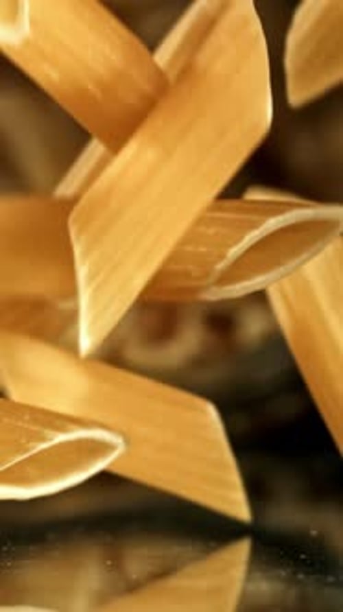 Super Slow Motion Dry Penne Pasta Filmed on a Highspeed Camera at 1000 Fps