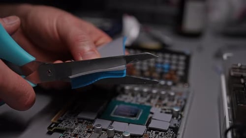 Cutting Ribbon On Top of Circuit Board