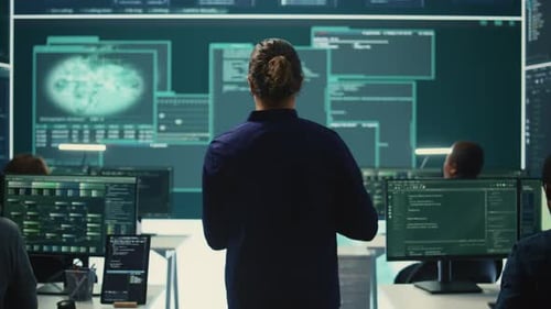 Employees Work With Code on Computer Screen