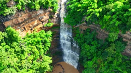 Stunning waterfall, multi-level rocks, lush greenery - Mesmerizing aerial view
