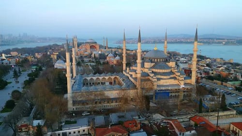 Aerial drone view of Istanbul at sunset, Turkey. The Blue Mosque and Hagia Sophia with gardens and r