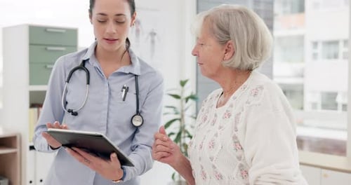Doctor Explains Medical Information to Senior Woman