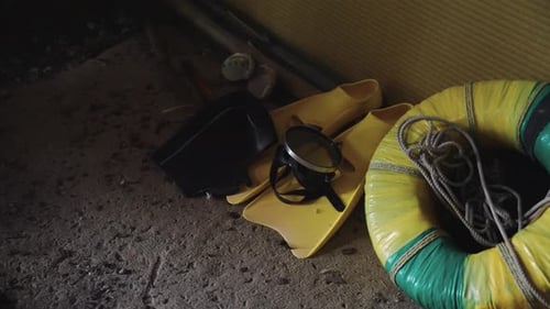 Mask, Flippers, and Floatation Device on Floor