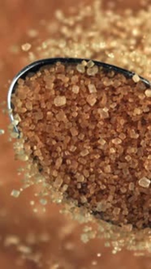 Cane Sugar Pours Out of a Spoon Filmed on a Highspeed Camera at 1000 Fps