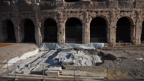 Reconstruction Ancient Ruined of Roman Colosseum Amphitheater on Sunny Day Concept of Restoration