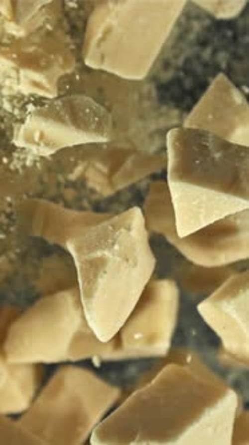 Pieces of White Chocolate Fly Up and Fall Down Filmed on a Highspeed Camera at 1000 Fps