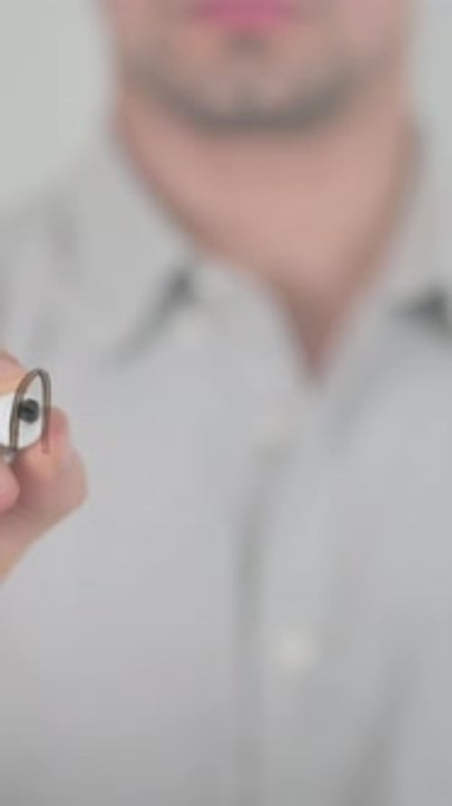 Man Writing 'Act Fast' on Clear Surface