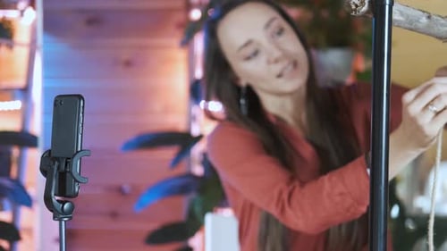 Woman Demonstrates Fiber Art Project for Smartphone Camera