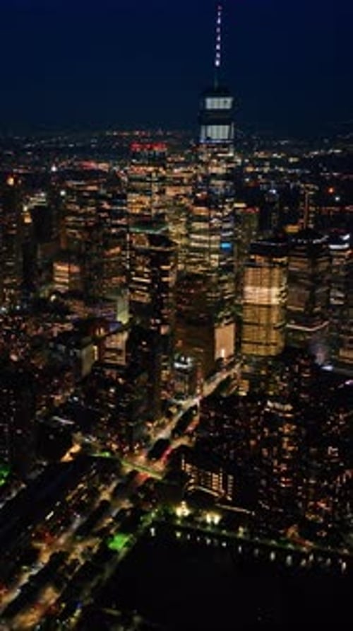 Glamorous New York scenery at night. Metropolis shining with billions of lights. Aerial view.