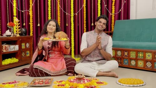 Couple Smiling and Celebrating Diwali at Home