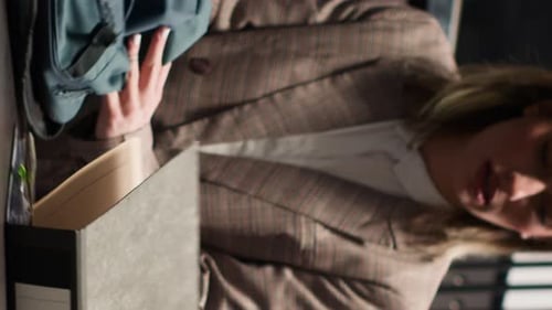 Colleagues Discussing Work Together in Modern Office