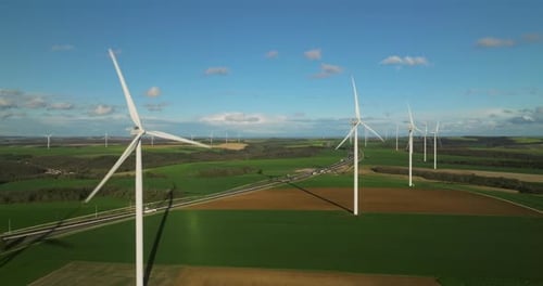Large White Power Generators That Generate Electricity From the Wind Wind Turbines in a Field