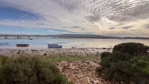 beautiful panorama of the beach with boats and a beautiful sky with clouds
