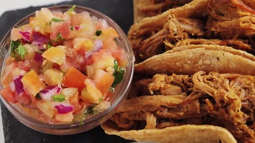 Delicious pulled pork tacos with fresh salsa