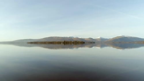 Reflections in the Calm Waters of Loch Lomond