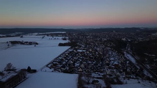 Charming suburb neighborhood of American town in winter season. Peaceful sunset scene in USA.