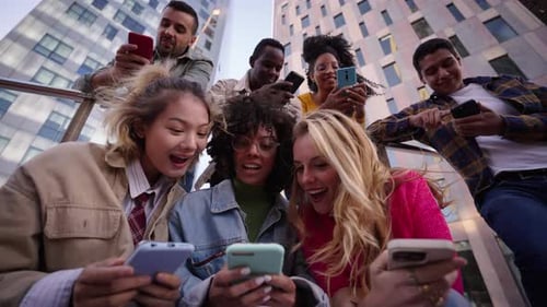 Group of Friends Using Phones in Urban Setting