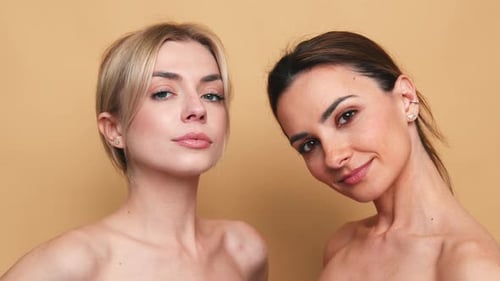 Two Young Women Posing in Close Up