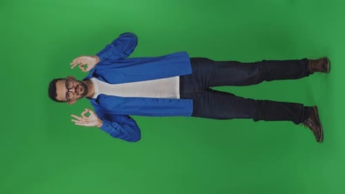 Man Gestures Ok on Green Screen Background