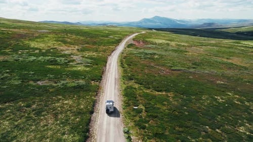 Aerial of Camper Van Drive Off Road on Mountain