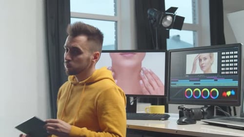 Freelance Videographer Colorist Editing Footage Using Professional Software Monitor and Montage