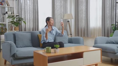Woman Video Calling on Smartphone in Living Room