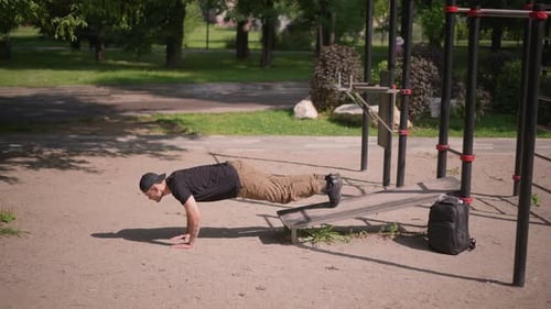 Workout In Park Intense Mountain Climber And Plank Move Session Outdoors Sunlit Park Scene With