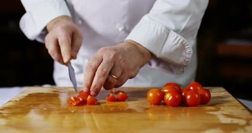 Chef Cutting Tomatoes
