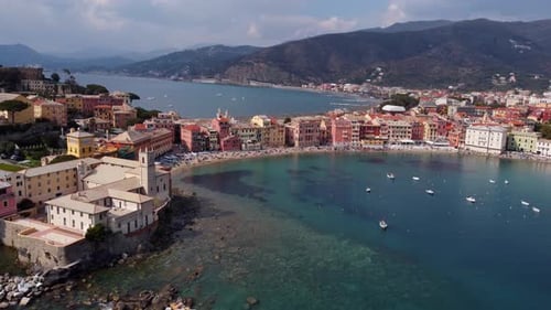 Sestri levante, italy showcasing colorful buildings and clear turquoise water, captured during dayli