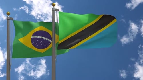 Realistic Brazil and Tanzania Flags Waving Against Cloudy Sky