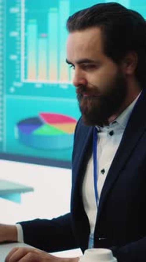 Vertical Video Corporate Employee Looking Into Project Details and Timetables