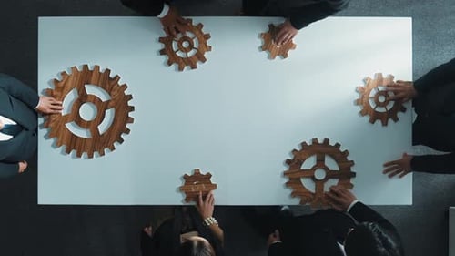 Top view of business people gather wooden cog together at meeting. Directorate.