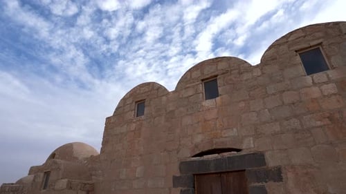 Pan Shot of UNESCO World Heritage Site Qasr Amra Desert Castle with Three Domes