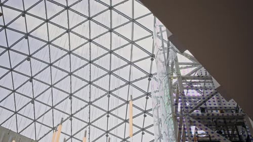 Commercial Building Interior with Geometric Glass Roof and Modern Lighting