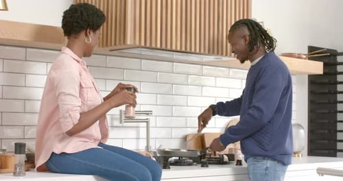 Couple Cooking Together in Modern Home Kitchen