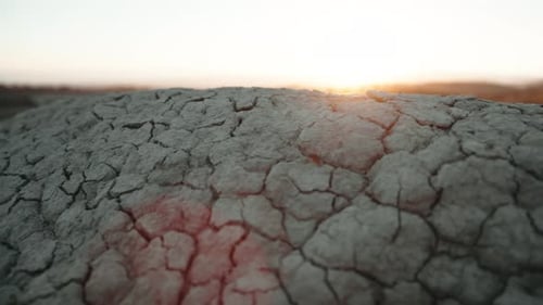 Cracked Earth Landscape at Sunrise