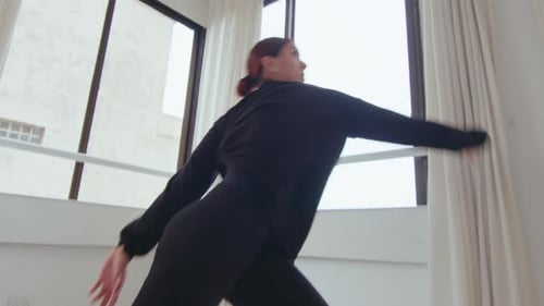 Inspired Female Performer Dancing Contemporary Style in Studio