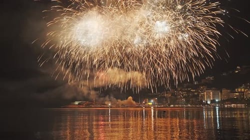 Fireworks with Colorful Lights Over Sea