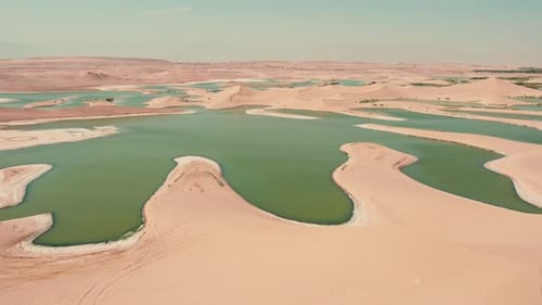 Stunning Drone Footage of Desert Oasis with Green Lakes