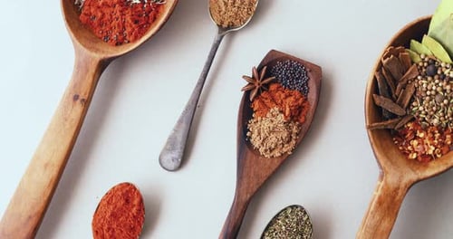 Assorted Spices Arranged in Spoons, Aerial Shot